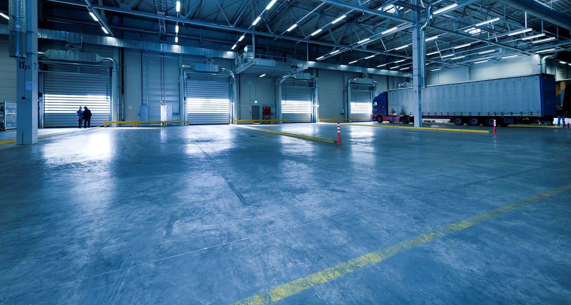 large Trans Ontario shipping warehouse with a blue floor.